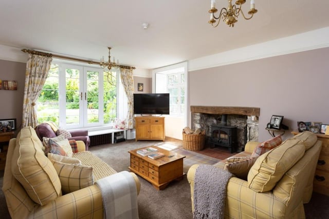 The sitting room has original shutters, and French doors to the garden.