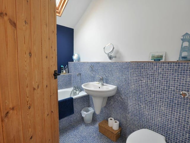There are three bathroom facilities in the house, one of which is a ground floor shower room.