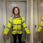 Women in construction often have to wear male PPE, Katy Robinson demonstrates here how male and female PPE coats fit vastly differently.