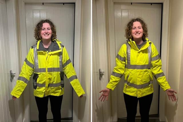 Women in construction often have to wear male PPE, Katy Robinson demonstrates here how male and female PPE coats fit vastly differently.