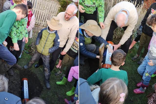 Children at Snainton School, Scarborough, bury the time capsule with Cllr David Jeffels.