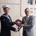 Bridlington Sea Cadets TS Pathfinder SCC member Finley Morris is presented with Cadet of the Year award 2023 by Bridlington Town Mayor Cllr John Arthur.
