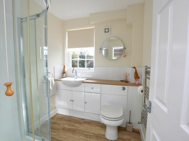 This modern shower room is a downstairs facility.