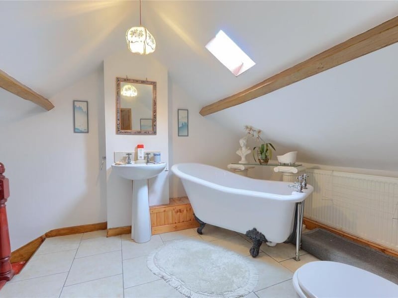 A free standing bath tub in this attractive facility.
