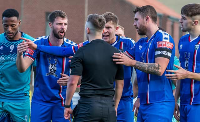 Whitby Town's players remonstrate with the referee after the award of a penalty for Stalybridge Celtic PHOTOS BY BRIAN MURFIELD
