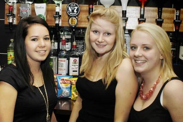 Bar staff keep the drinks flowing.