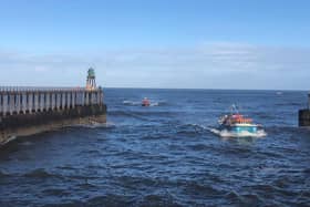 Whitby lifeboat tows the fishing vessel back to port after it got into difficulties off Staithes.