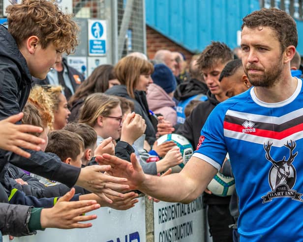 Dan Rowe thanks the Blues fans after their 2-0 home win against Macclesfield in the final game of the league season. PHOTO BY BRIAN MURFIELD