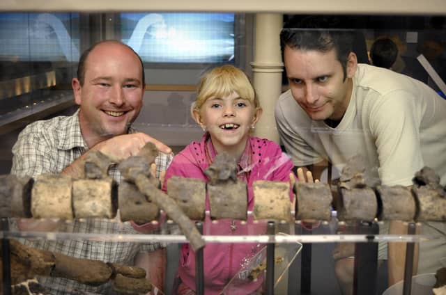 Will Watts, left, of Scarborough Museums Trust, shows the bones of a dinosaur to visitors at an event at the Rotunda Museum on Bank Holiday Monday.