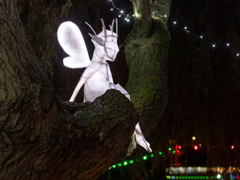 A forest sprite hiding in the tree boughs.