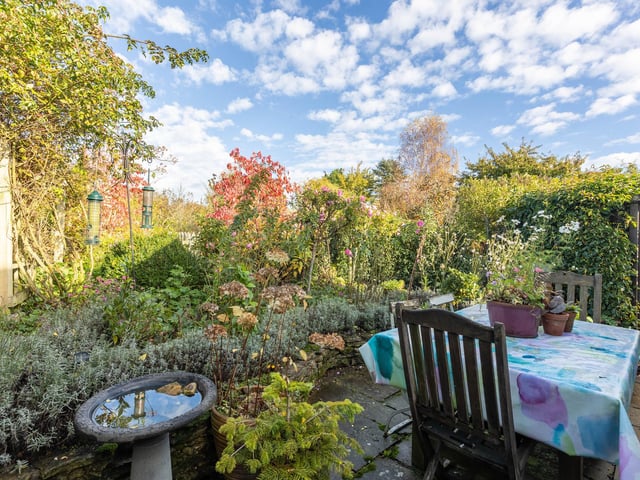 The cottage garden with seating area.