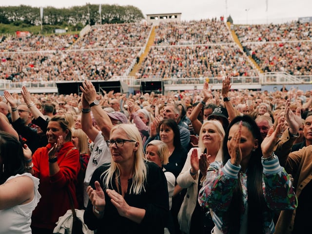 A packed crowd enjoy the show