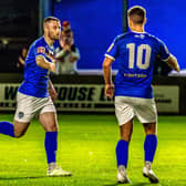 Bradley Fewster, left, earned Whitby Town their first draw of season at FC United of Manchester. PHOTO BY BRIAN MURFIELD