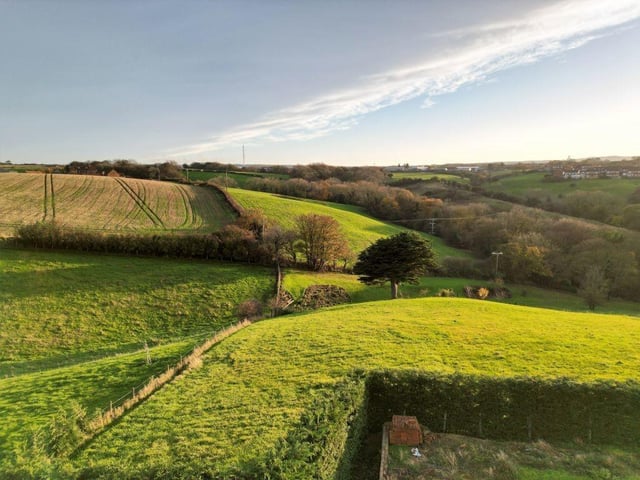 Beautiful scenery surrounds the property that has a private terrace with a southerly aspect and rural views. A courtyard offers off-street parking