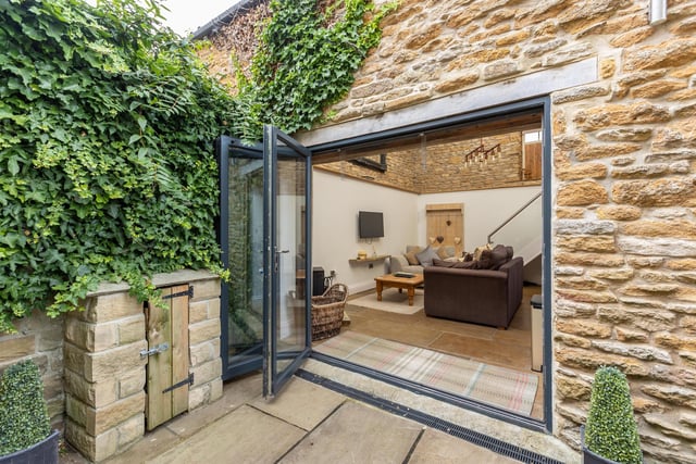 From outside in, to the stone built annexe.