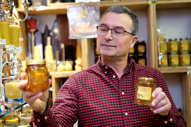 Jovan of the Honeycomb Shop creates honey and candles from the honey and wax from his own bees. His shop is located on the Mezzanine.