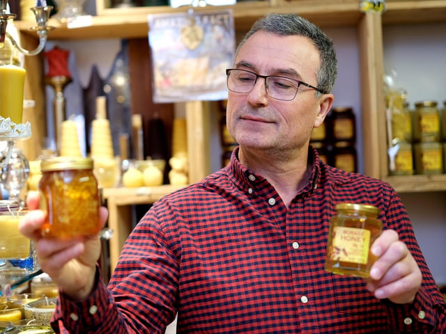 Jovan of the Honeycomb Shop creates honey and candles from the honey and wax from his own bees. His shop is located on the Mezzanine.