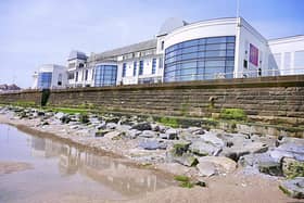 Aled Jones frames the Spa complex from the beach.