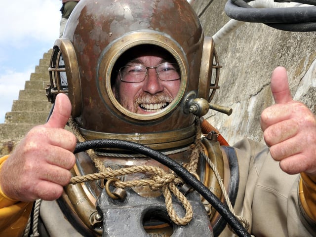 Scarborough Harbourmaster Martin Willis, who tried traditional 'hard hat' diving into the harbour, with advice from diving instructor Howard Dykes, of the Historical Diving Society. pic by Andrew Higgins