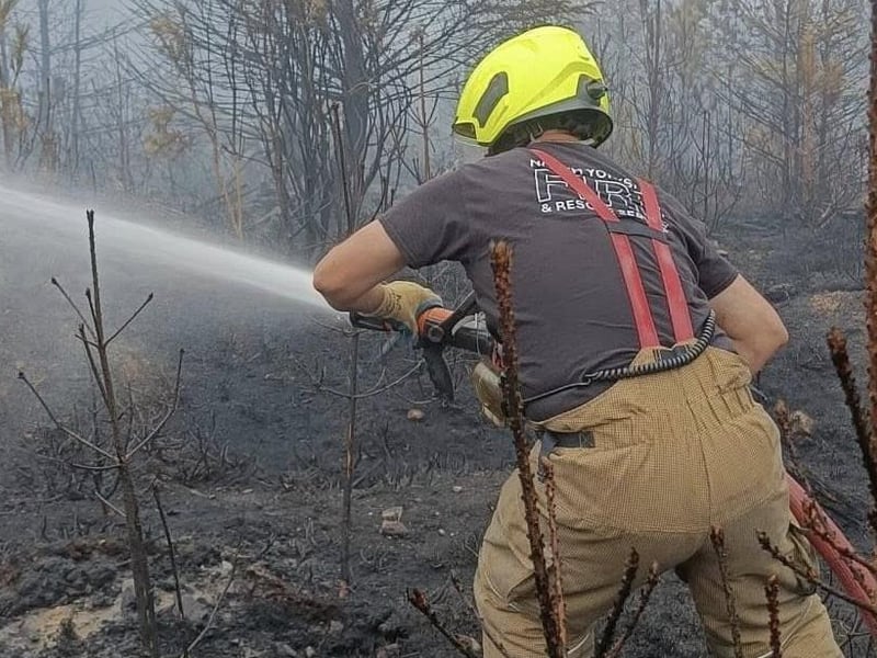Firefighters trying to dampen down hotspots.