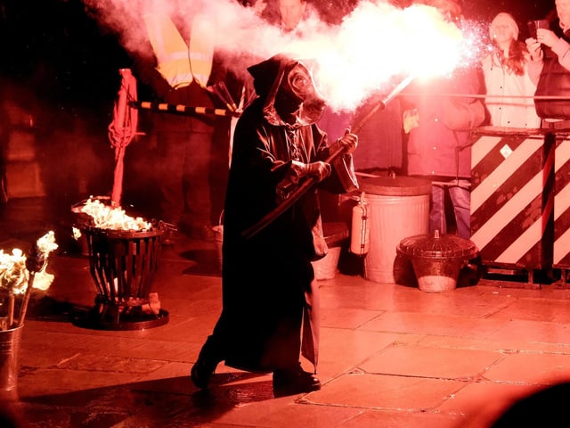 Lighting the flames at the end of the Krampus Run.
picture: Richard Ponter