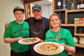From left: Theo Smith, Stan Coulson and Hannah Coulson at the Pizza Pals cafe at Whitby Coliseum.