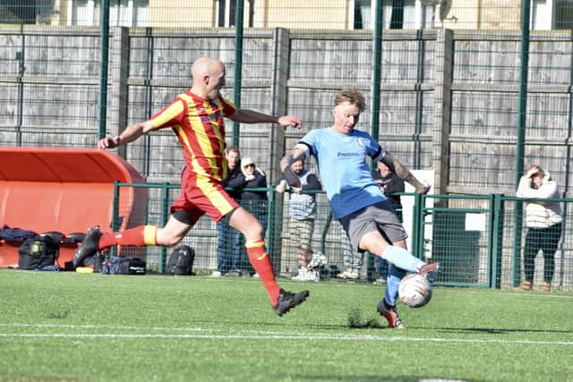 Rovers Millau, blue kit, look to beat Langtoft to the ball.
