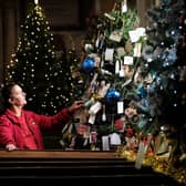 St Mary's Church Maid Nicola Hutchinson views the festive trees.
pic Richard Ponter, 225201a