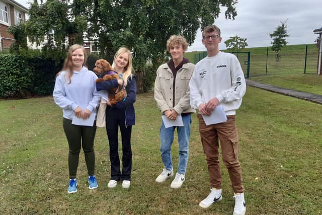 From left: Eskdale School students Elodie Hermann, Tamsin Buckle with Zola, James Everall and Elijah Henderson.