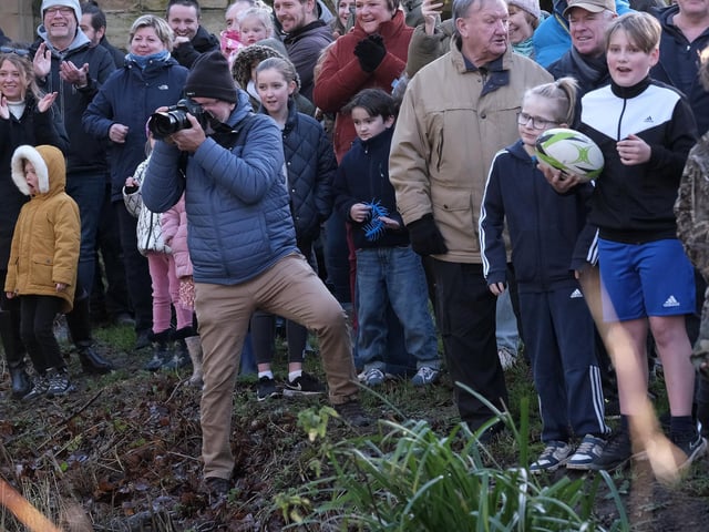 The crowds look on