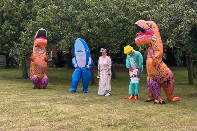 Staff from Combe Hay take part in a fancy dress race.