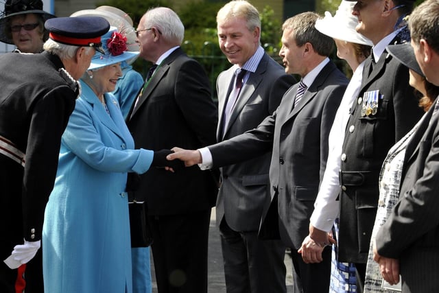 The Queen shakes hands with Robert Goodwill, newly returned Conservative MP for Scarborough and Whitby. Next to him(L) is Richard Flinton, head of North Yorkshire County Council.
102036w