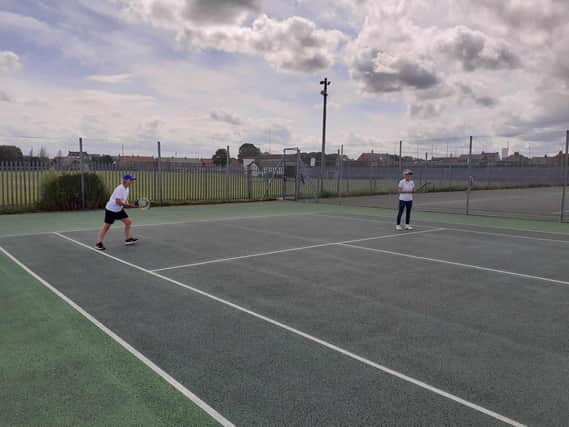 Jill Crawford and Penny Clarke playing ladies doubles at Bridlington Lawn Tennis Club.