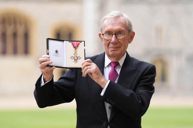 Peter Taylor poses with his CBE. Photo by Andrew Matthews/Poll/AFP via Getty Images