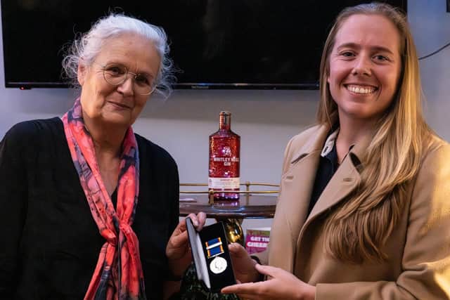 Anna Heslop presenting Patricia Hutchinson with her 30 year service medal - RNLI/James Stoker