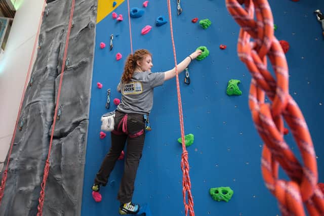 Ava Moorcroft tries out the climbing wall at The Street