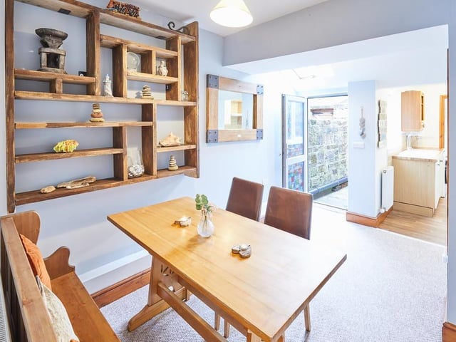 The dining room with a display shelf for beach finds