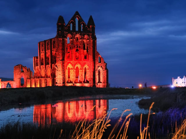 Whitby Abbey looking haunting bathed in light.