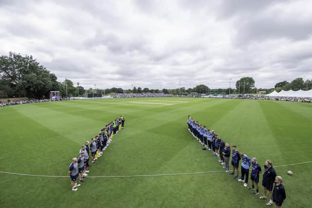 Yorkshire and Hampshire players line up for a minute's silence to remember Sir Michael Parkinson before today's match. Photo: Allan McKenzie/SWpix.com