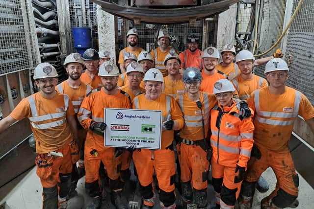 The Anglo American team with a certificate to show the boring machine Stella Rose has reached 30,000M.