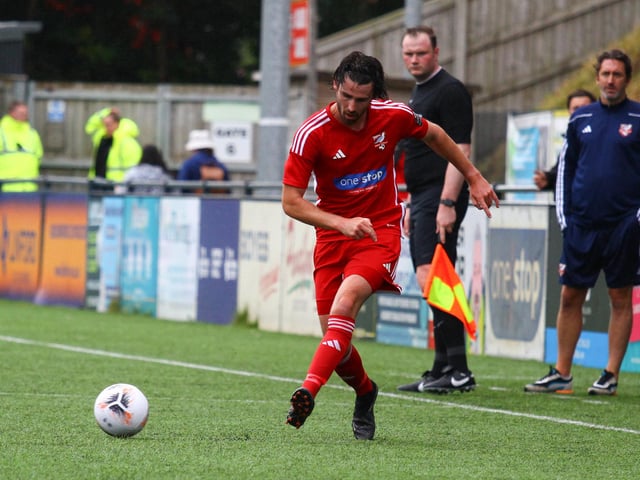 Midfielder Alex Purver pushes on for the hosts.
