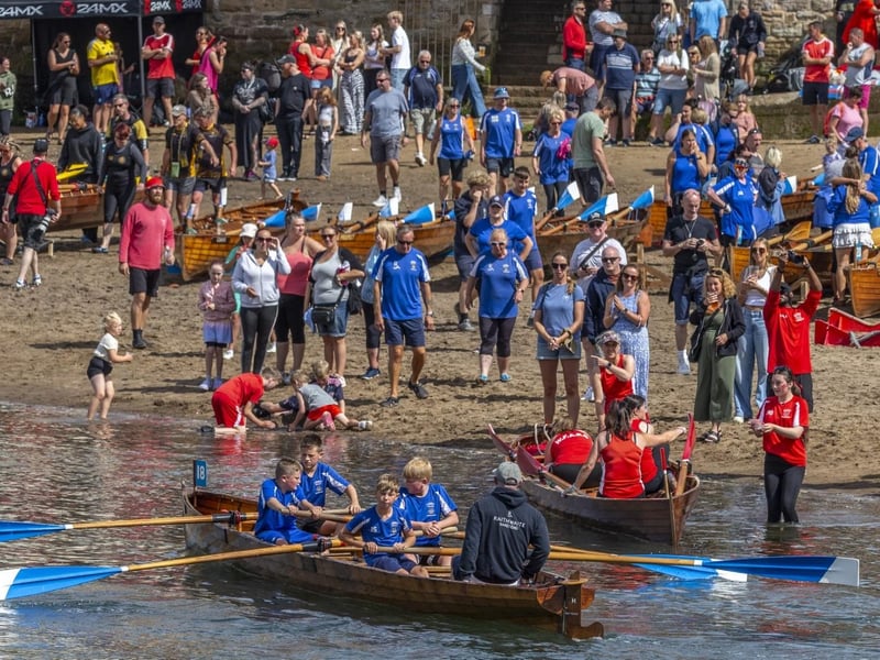 A hive of activity on the beach, outside the rowing clubs. photo: Brian Murfield