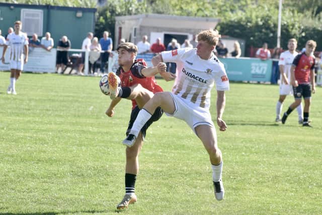 Bridlington Town, white kit, get stuck in at Knaresborough Town in the FA Cup Extra Preliminary Round. Photo by Alexander Fynn