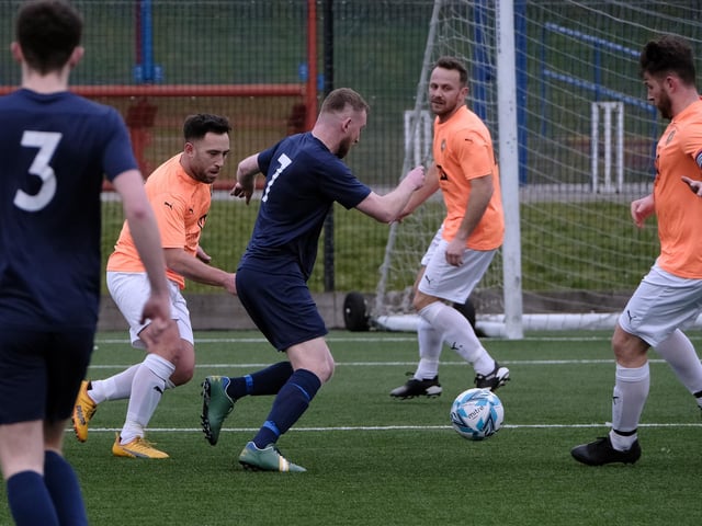 Edgehill captain Joe Gallagher, right, closes on on stopping the run of Haxby Town's number seven