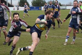 Scarborough RUFC's Joe Davies tackles an Old Crossleyan. PHOTOS: CHARLIE HOPPER