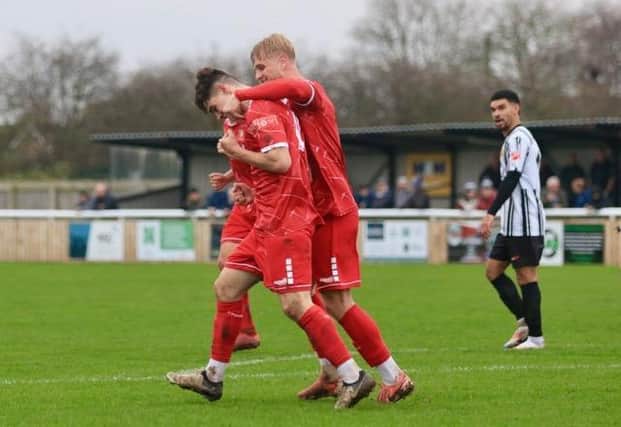 Sam Leverett is congratulated after one of his two goals in the 3-2 loss at Ashington on Saturday afternoon. PHOTO BY TCF PHOTOGRAPHY
