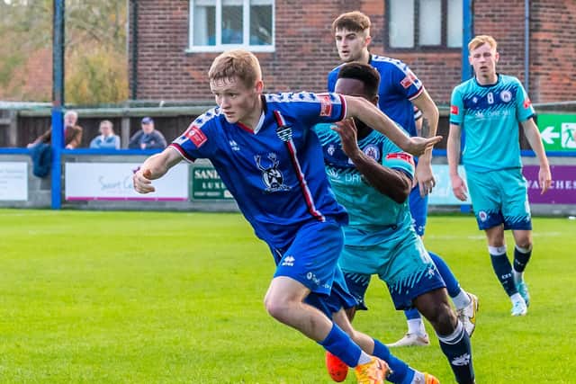 Harry Green pushes on for Whitby Town in the 1-0 home loss against Stalybridge Celtic