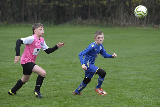 Ayton Under-13s (pink kit) and Eastfield Under-13s keep their eyes on the ball in the league match