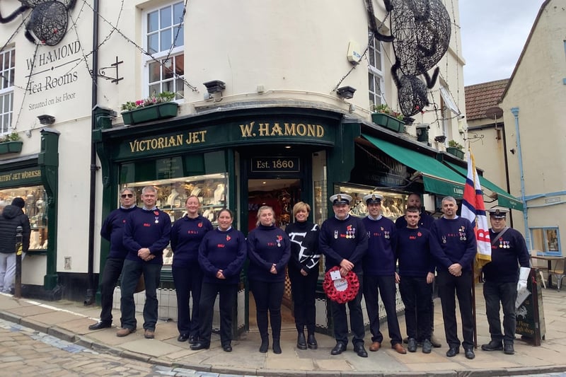 Whitby RNLI crew on their way to a Remembrance church service at St Mary's with a fundraiser from W Hamond Jewellers.