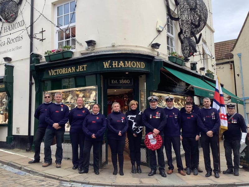 Whitby RNLI crew on their way to a Remembrance church service at St Mary's with a fundraiser from W Hamond Jewellers.